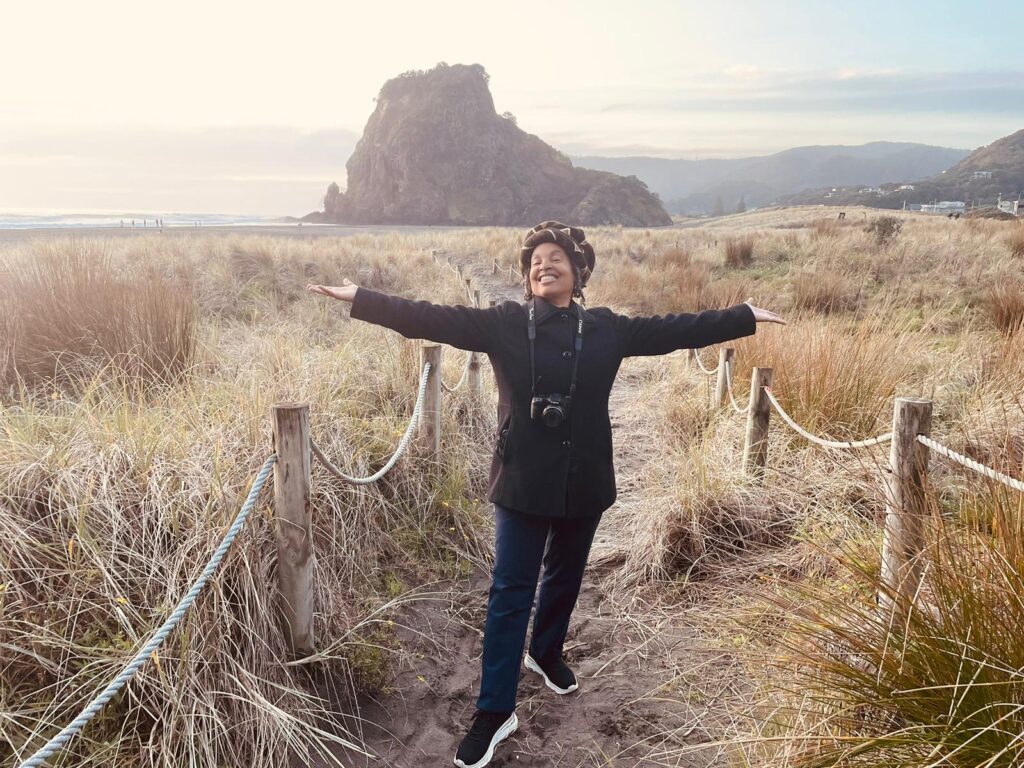 Me at the entrance to Piha Beach in Auckland, NZ